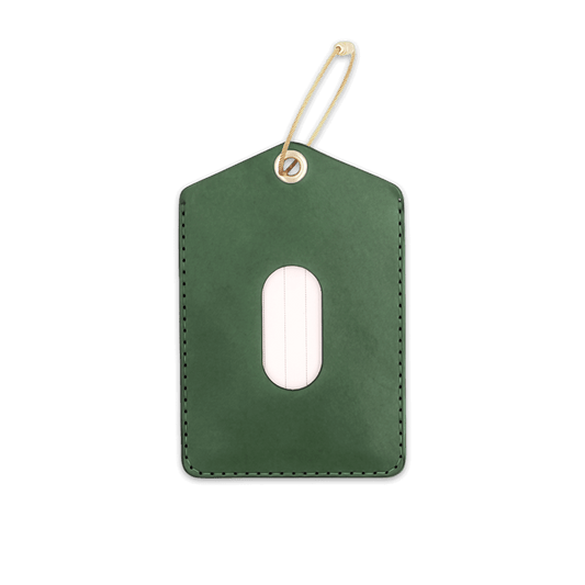 Green leather rectangular luggage tag with stitching, info card window, and brass hardware.