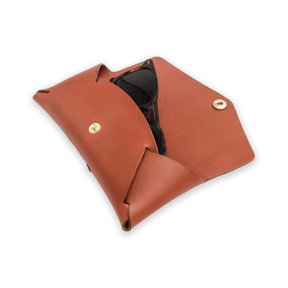 Brown leather glasses case open with sunglasses