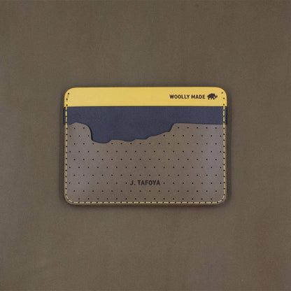 Olive, navy, and yellow leather half wallet with state of Oregon-shaped pocket with custom etched name and Woolly Made logo.