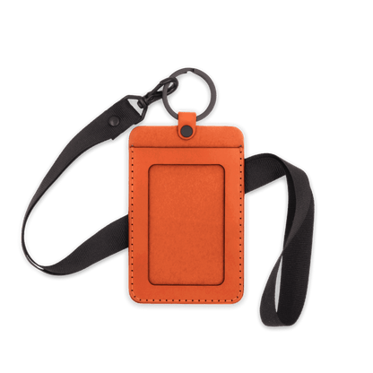 Orange leather ID Badge Holder with pocket window, black hardware, and black lanyard.