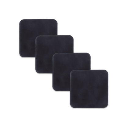 Black square leather coasters spread out.