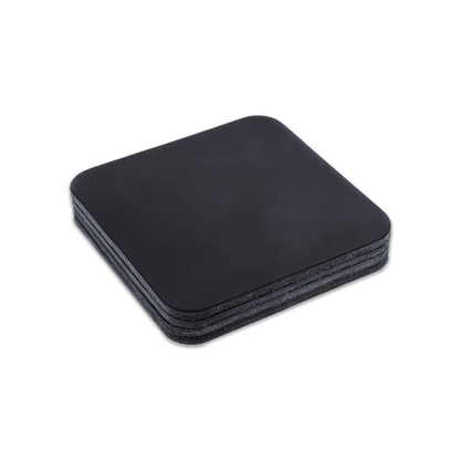 Black square leather coasters stack.