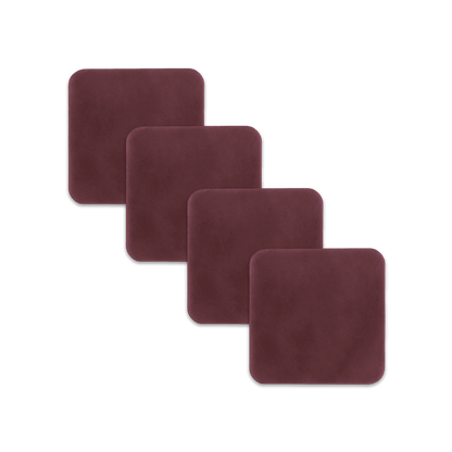 Burgundy square leather coasters spread out.