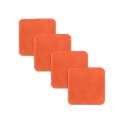 Orange square leather coasters spread out.