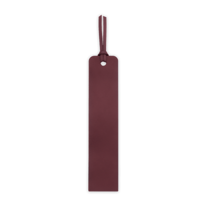 Burgundy leather luggage tag on a black background