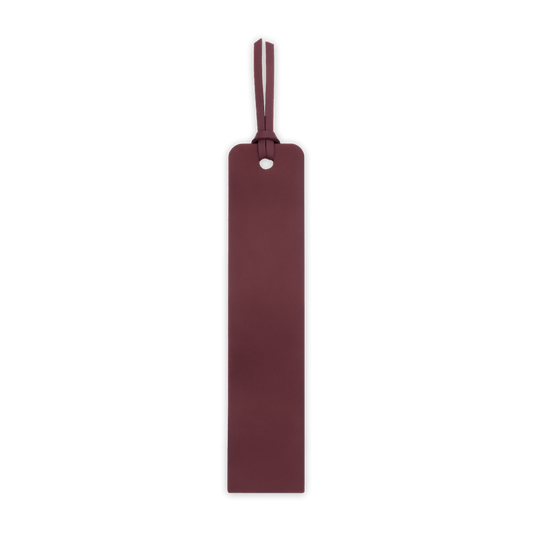 Burgundy leather luggage tag on a black background