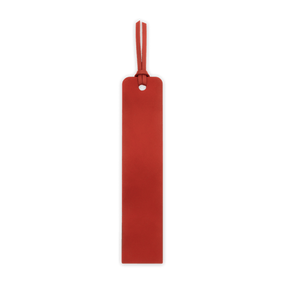 Red leather tag with a strap on a black background