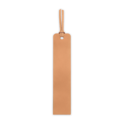 Rectangular tan leather tag with a hole on a black background