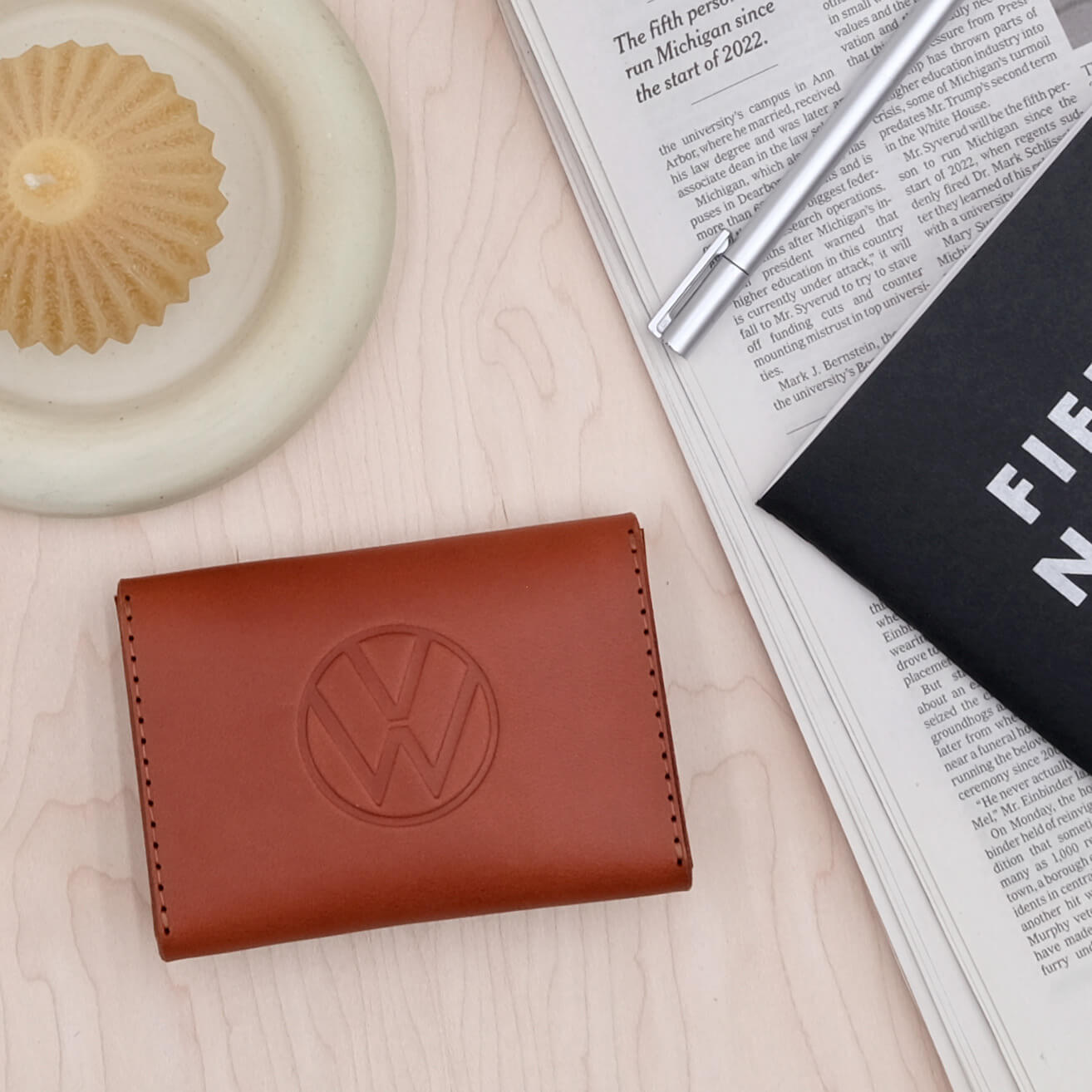 Back image of Woolly Made's Snap Wallet with a debossed logo.