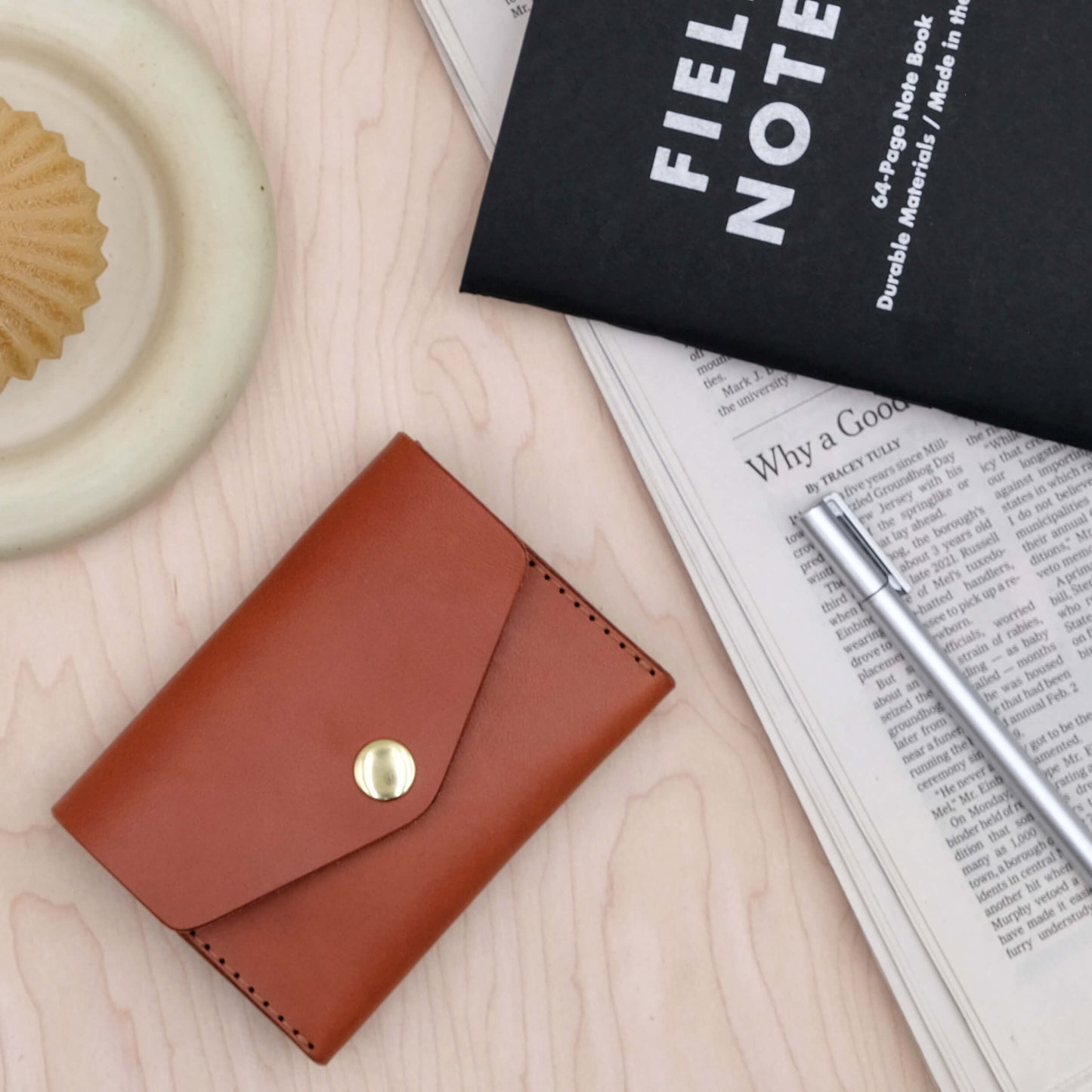 Front image of Woolly Made's Snap Wallet with a bras snap closure.